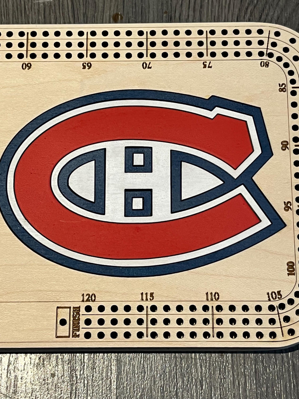 cribbage board with painted logo