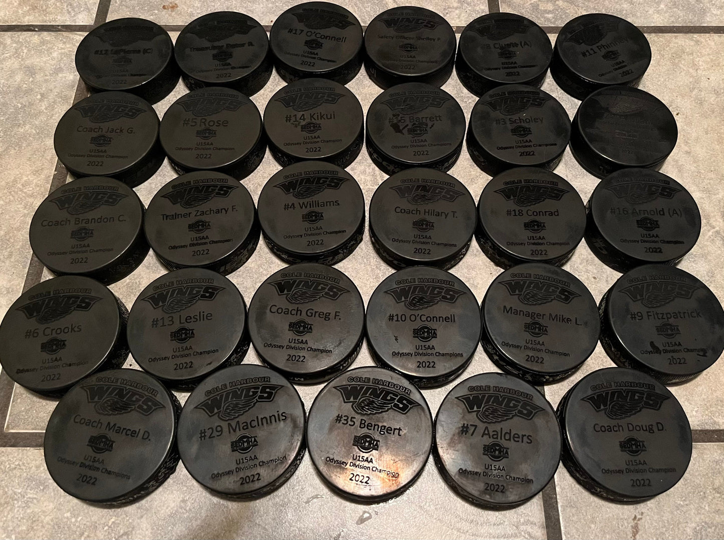 Custom Engraved hockey pucks (full team and coaches)