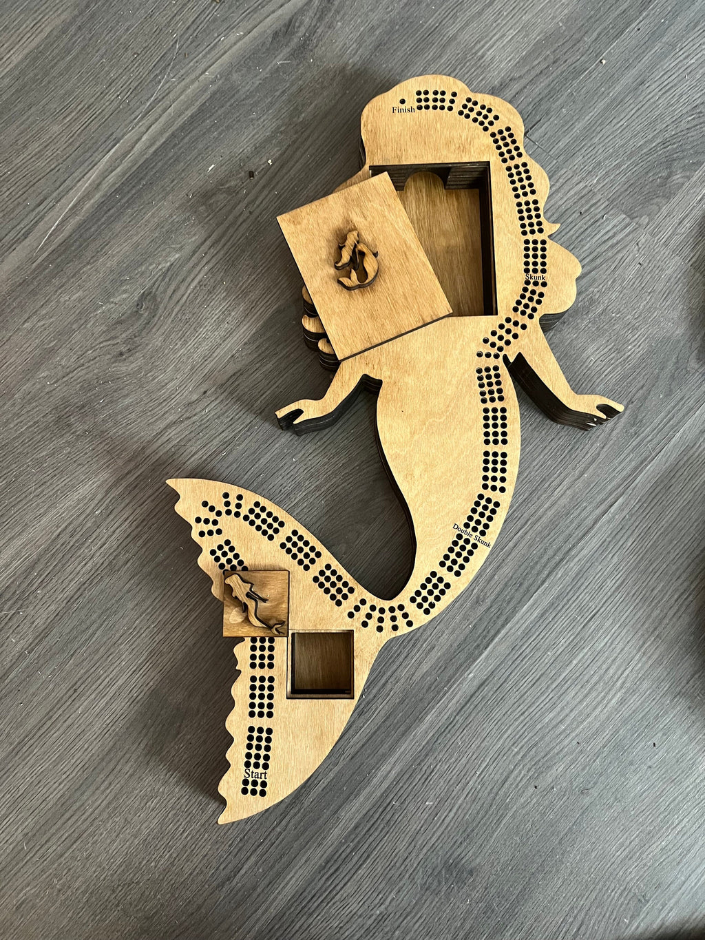 Mermaid shaped cribbage board