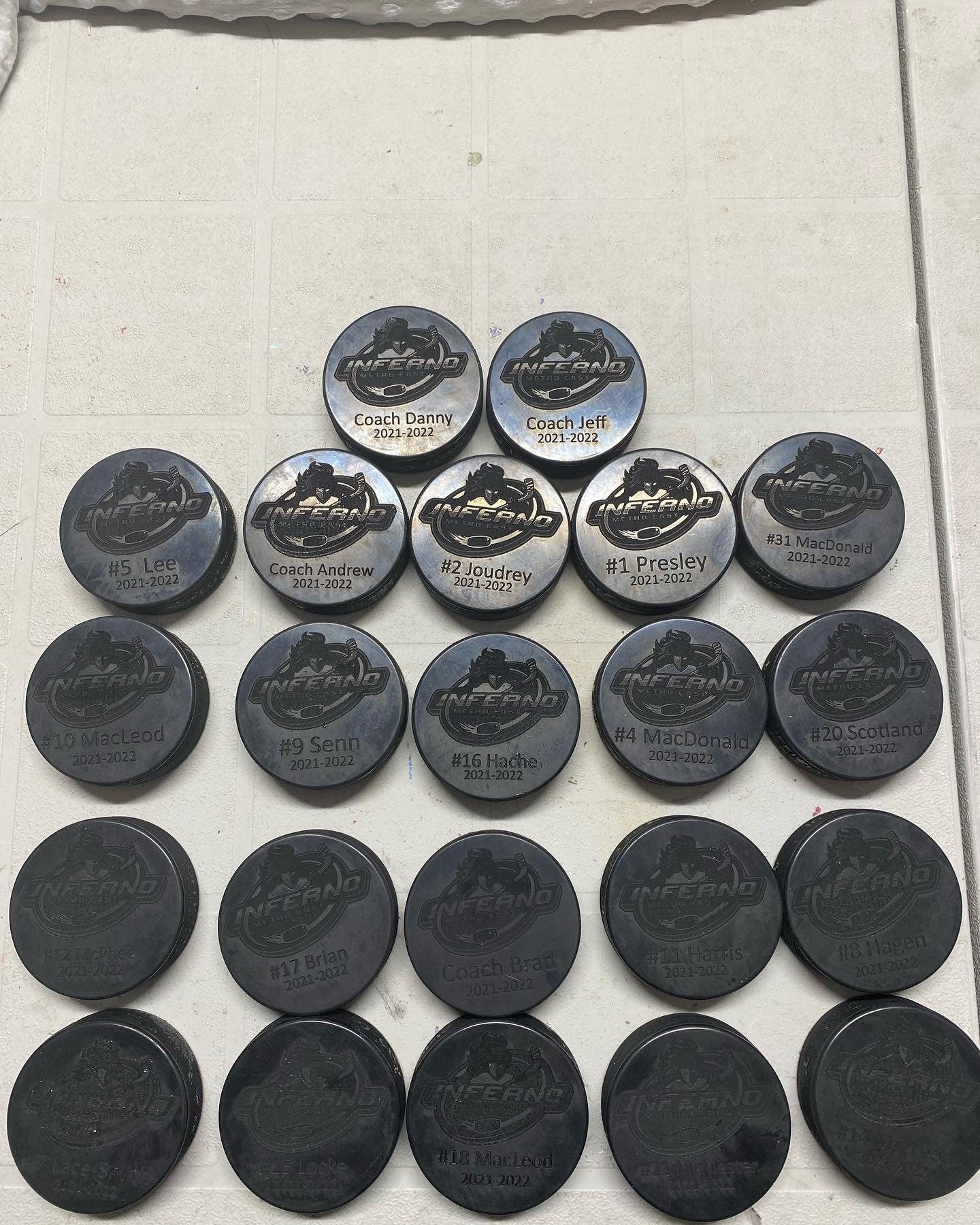 Custom Engraved hockey pucks (full team and coaches)