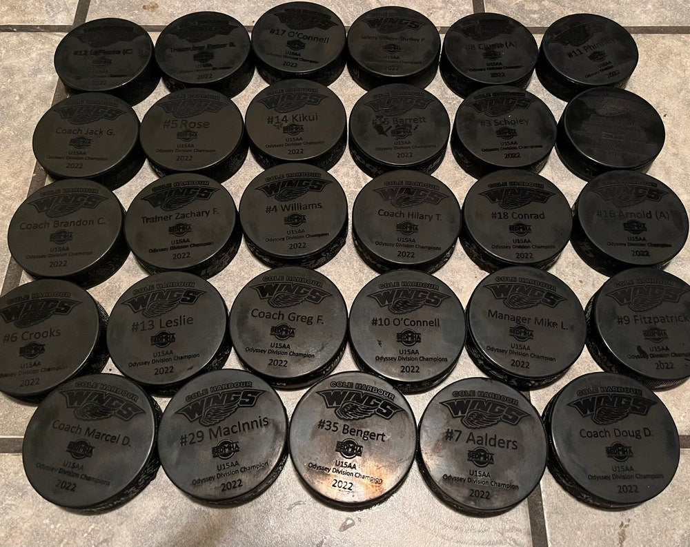 Custom Engraved hockey pucks (full team and coaches)